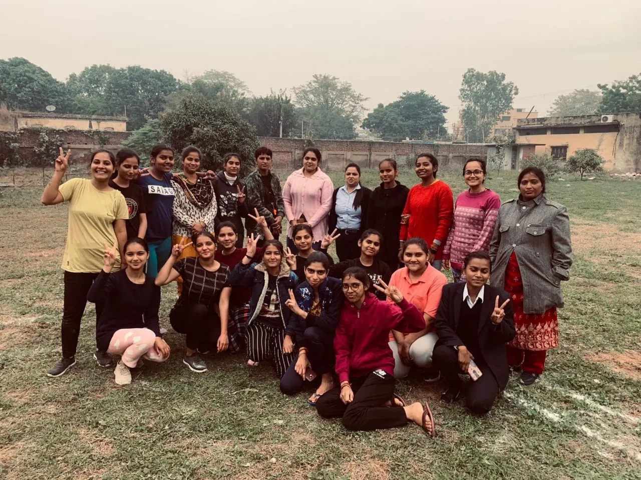 Group photo of OSPMI students on the campus ground